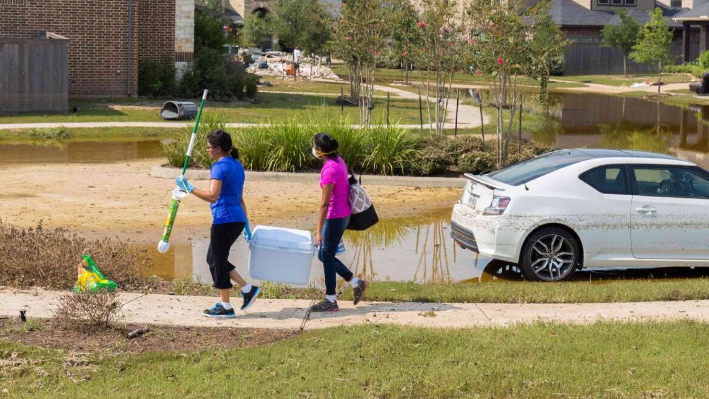 Houston residents clean up debris after heavy flooding brought about by Hurricane Harvey