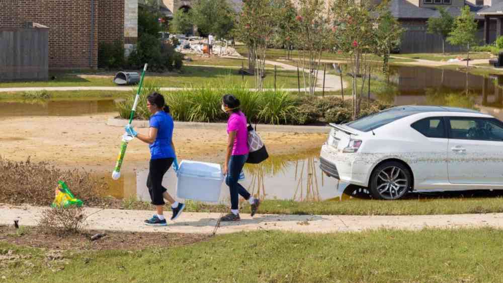 Houston residents clean up debris after heavy flooding brought about by Hurricane Harvey