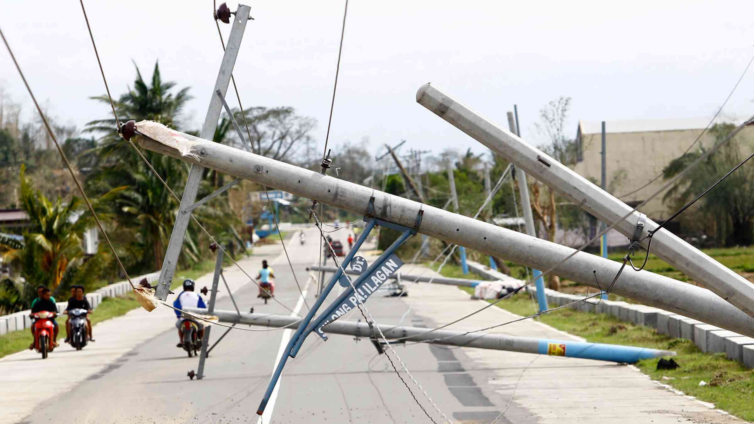 Collapsed electric posts along the highway after Typhoon Haima