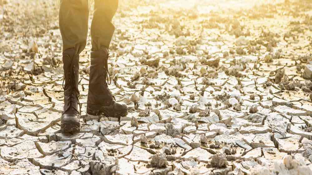 Military man in dry area