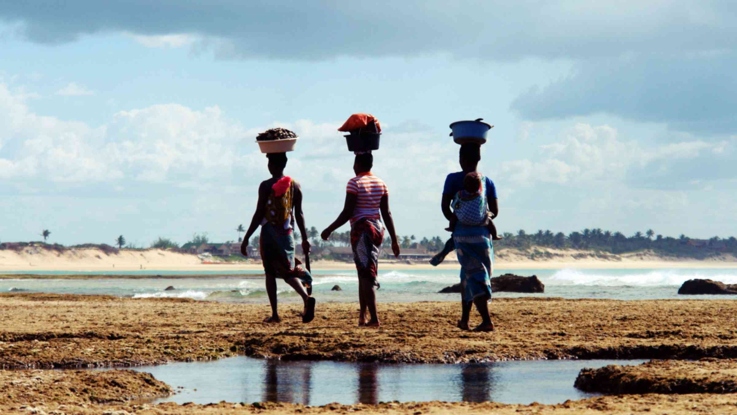 Three women on a beach in a Mozambique