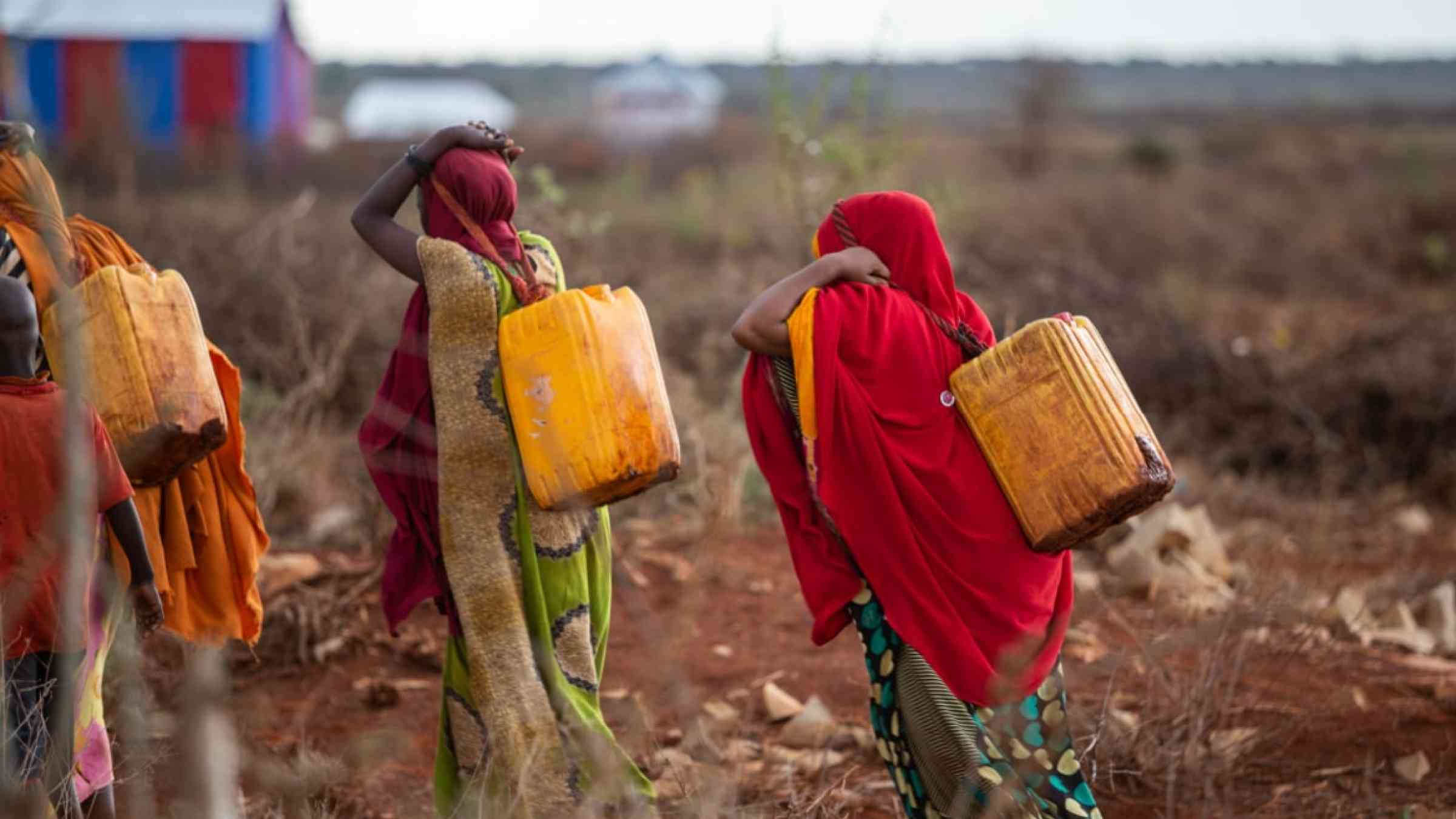 Women carrying water in Somalia.