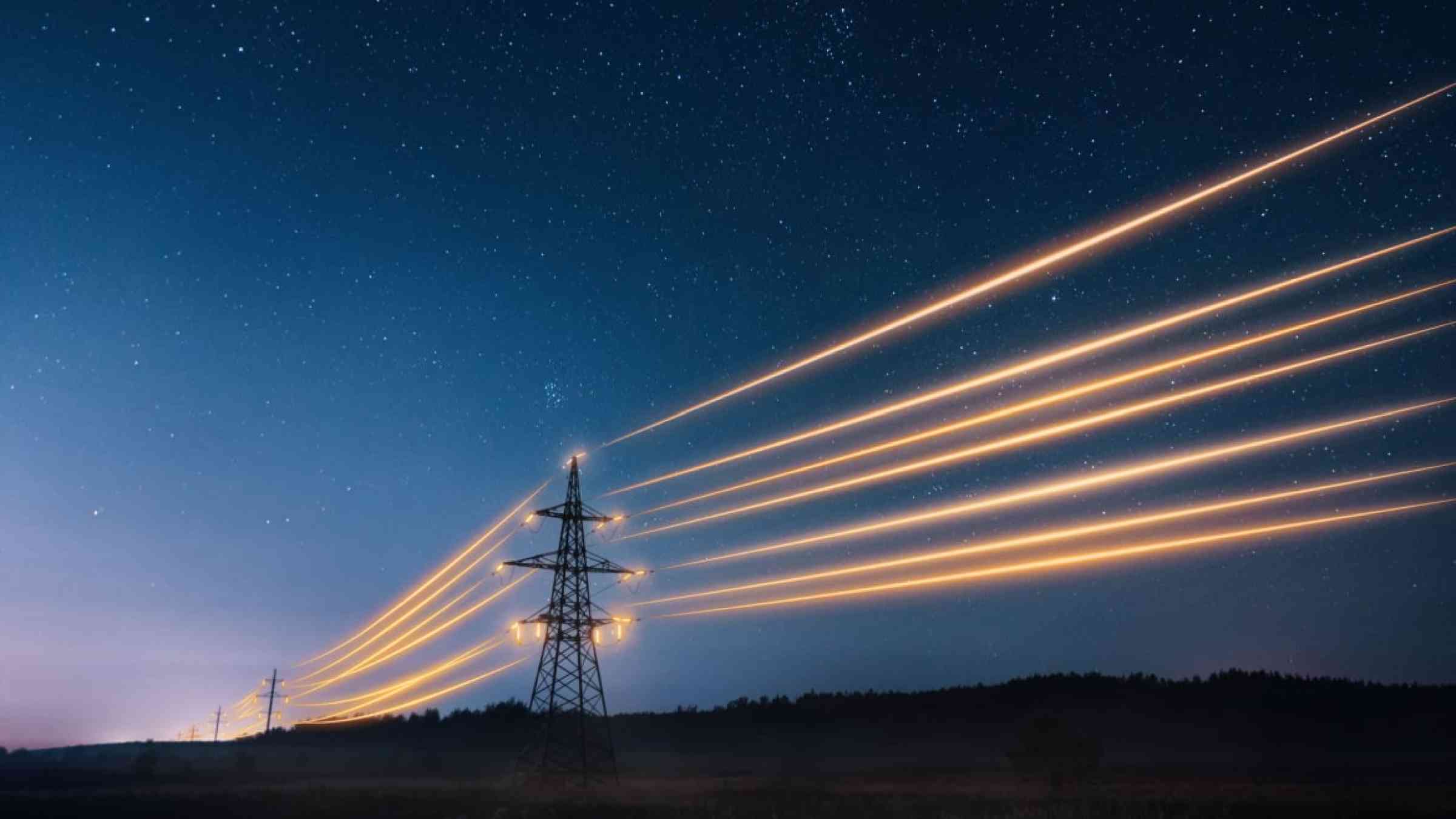 Power transmission towers with orange wires in the starry sky. Power infrastructure concept.