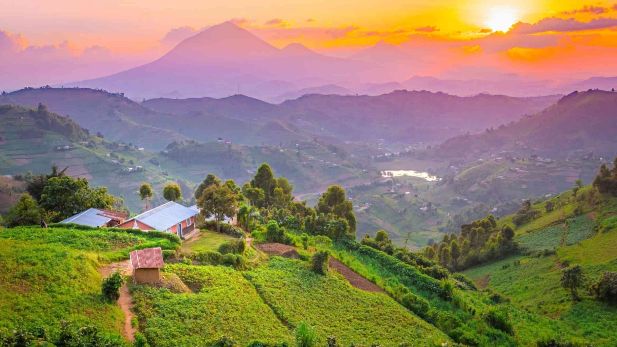 Kisoro Uganda beautiful sunset over mountains and hills of pastures and farms in villages of Uganda.