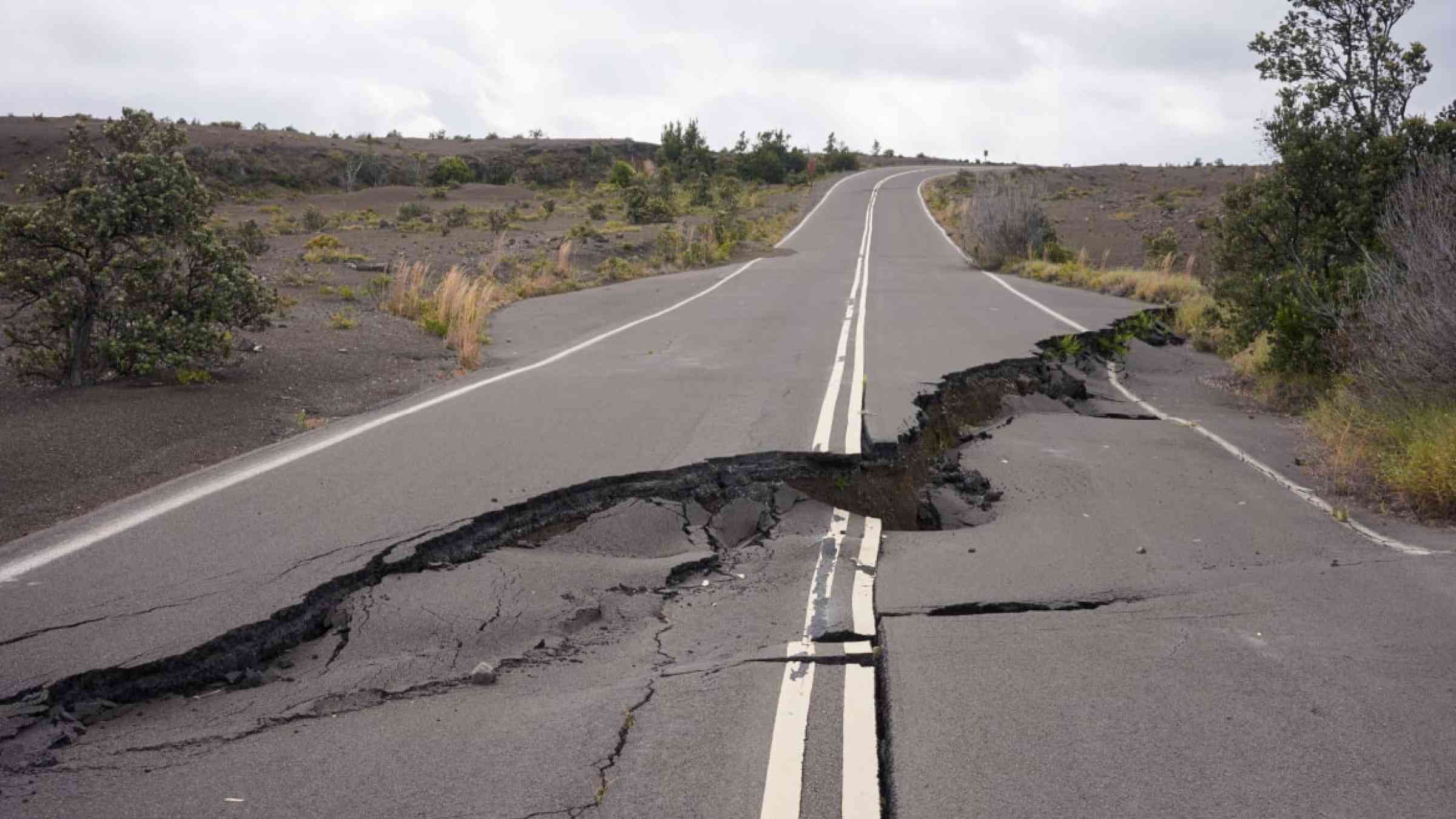 Big crack in a road following an earthquake.
