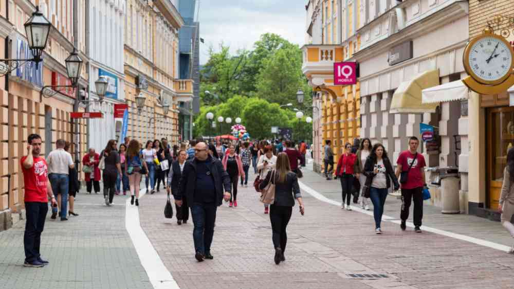 Crowd of anonymous people walking on a busy street in Bosnia and Herzgovina
