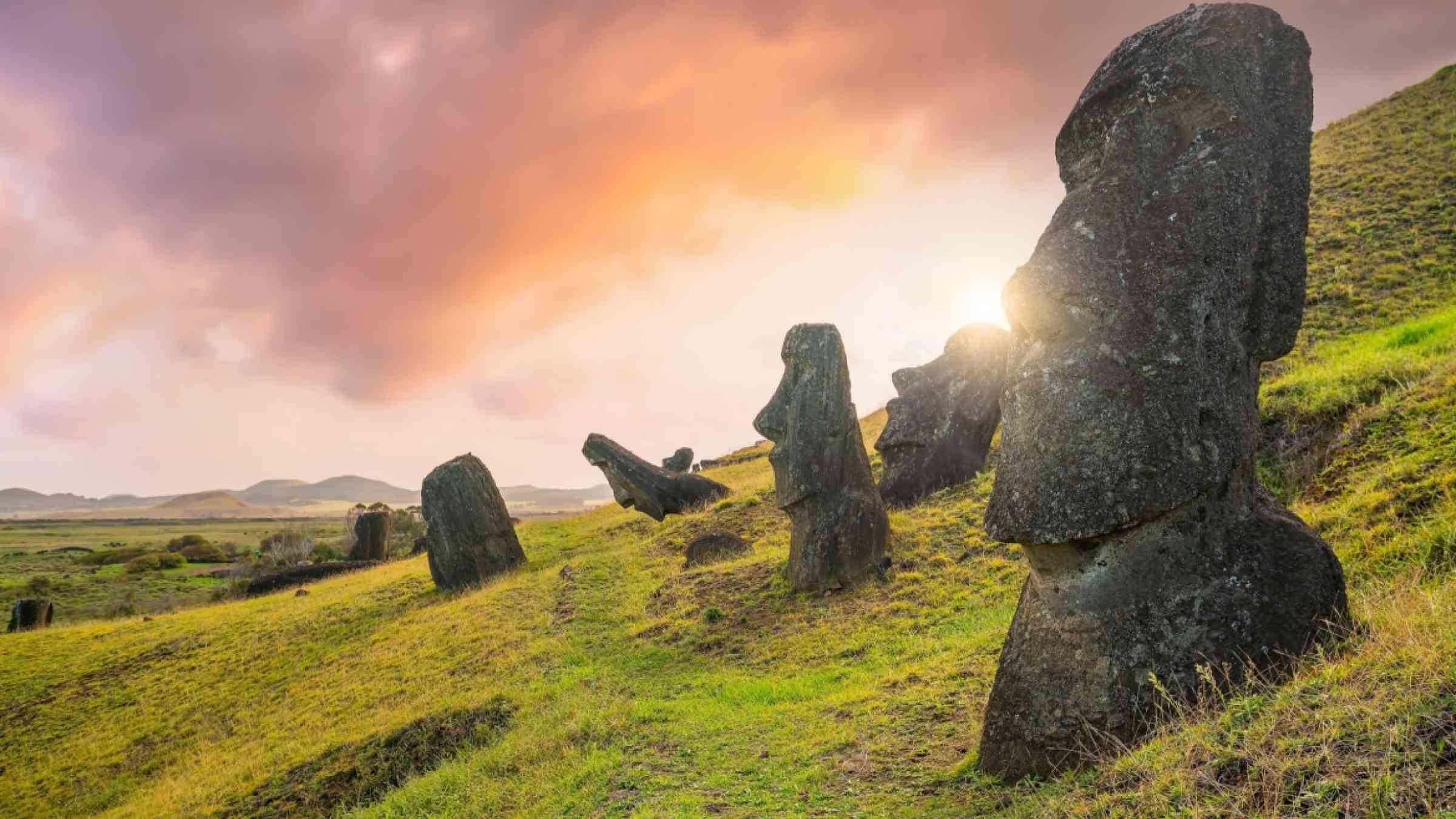 The ancient moai on Easter Island 2,000 miles off the coast of Chile at sunset