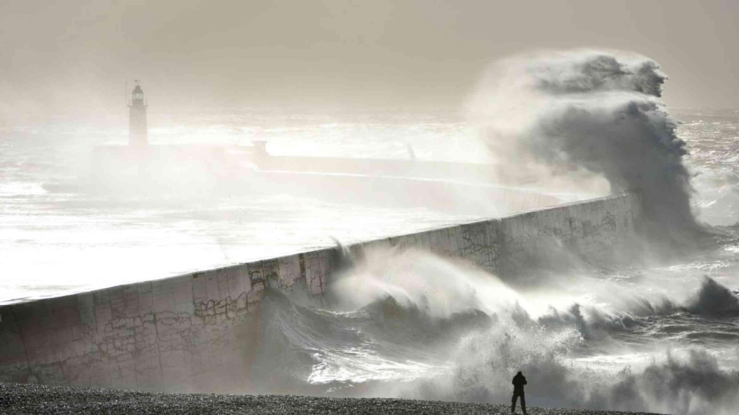Huge waves striking Newhaven breakwater, UK, during a winter storm