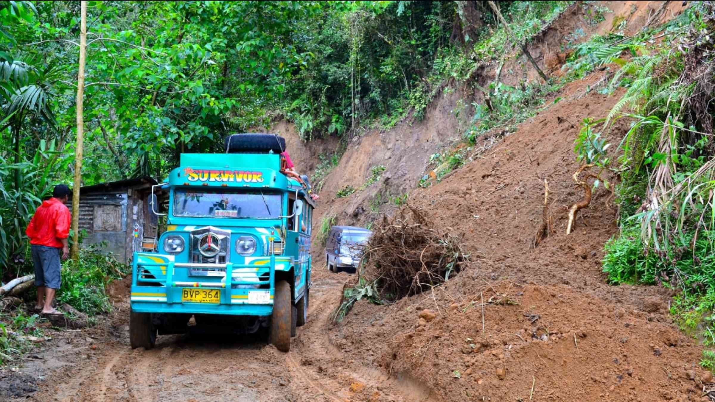 Landslide on the way from Hapao village in Banaue province in the Philippines, affecting the road taken by a bus