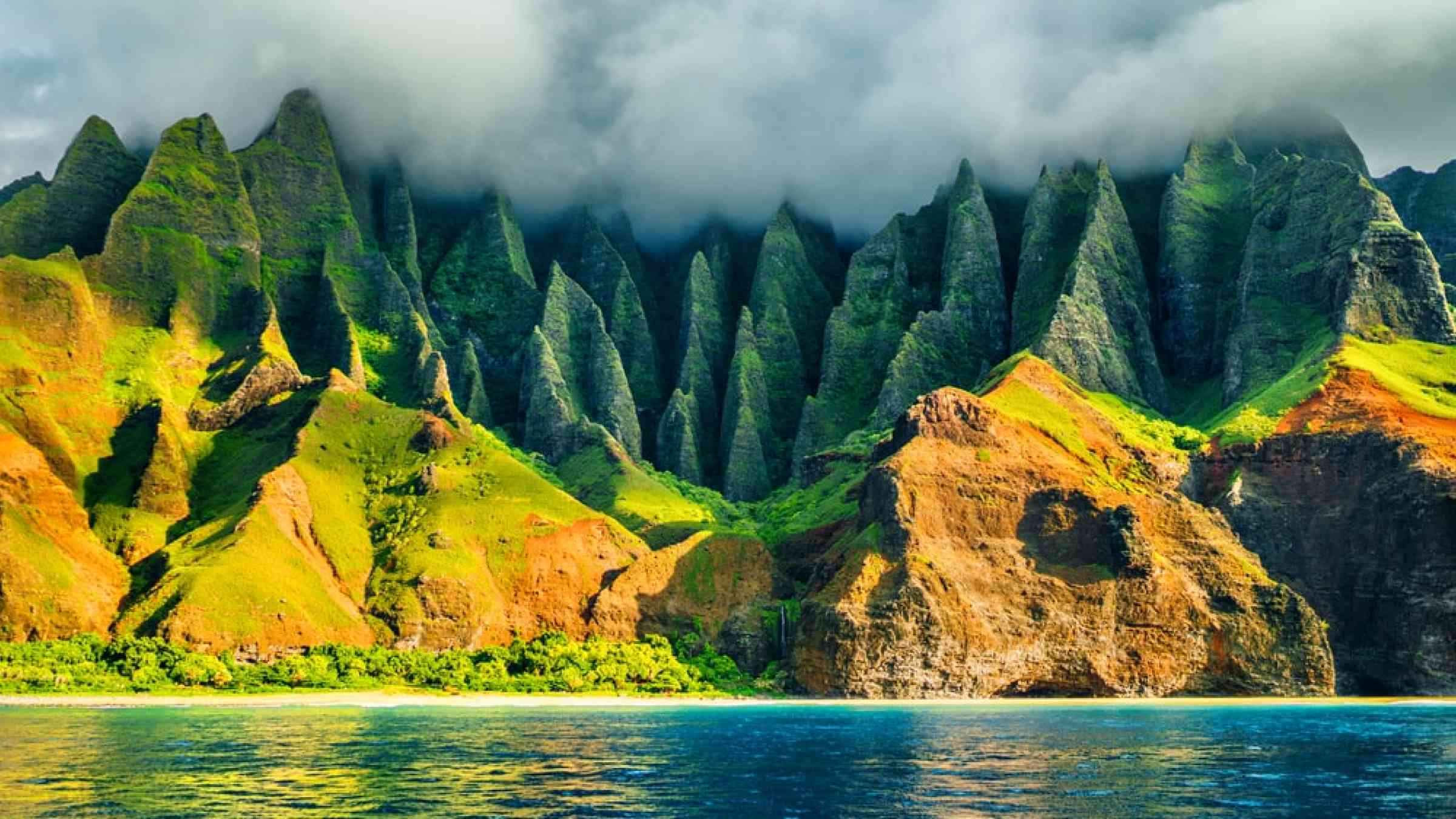 Na Pali coast, Kauai, Hawaii view from sea sunset cruise tour. Nature coastline landscape in Kauai island, Hawaii, USA.