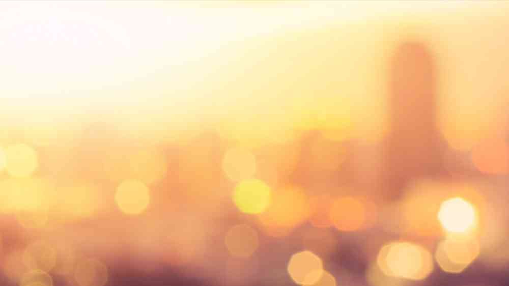 Blurry image of a sunny urban skyline