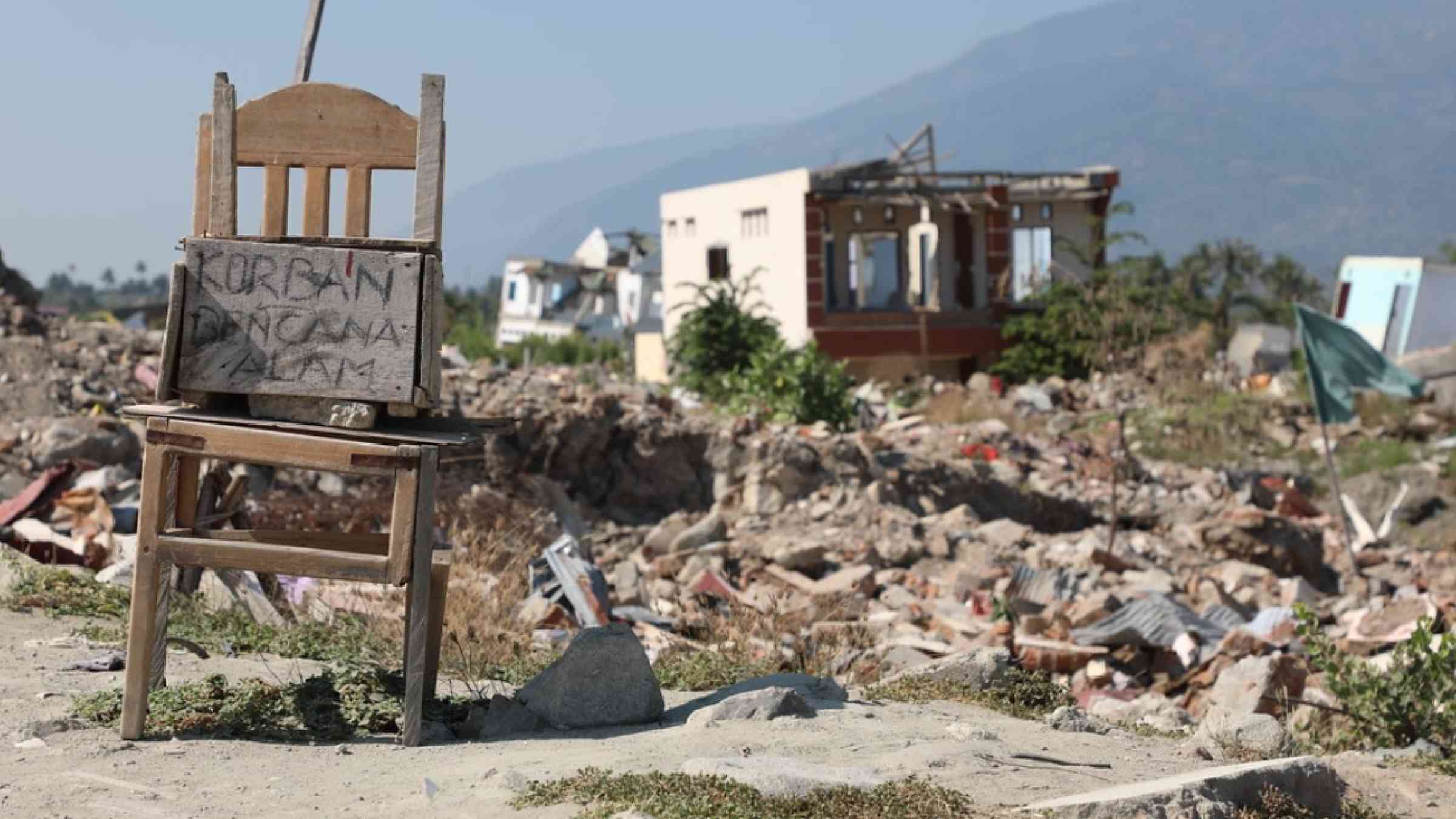 A warning sign is set up to dissuade visitors from a liquefaction zone in Sulawesi