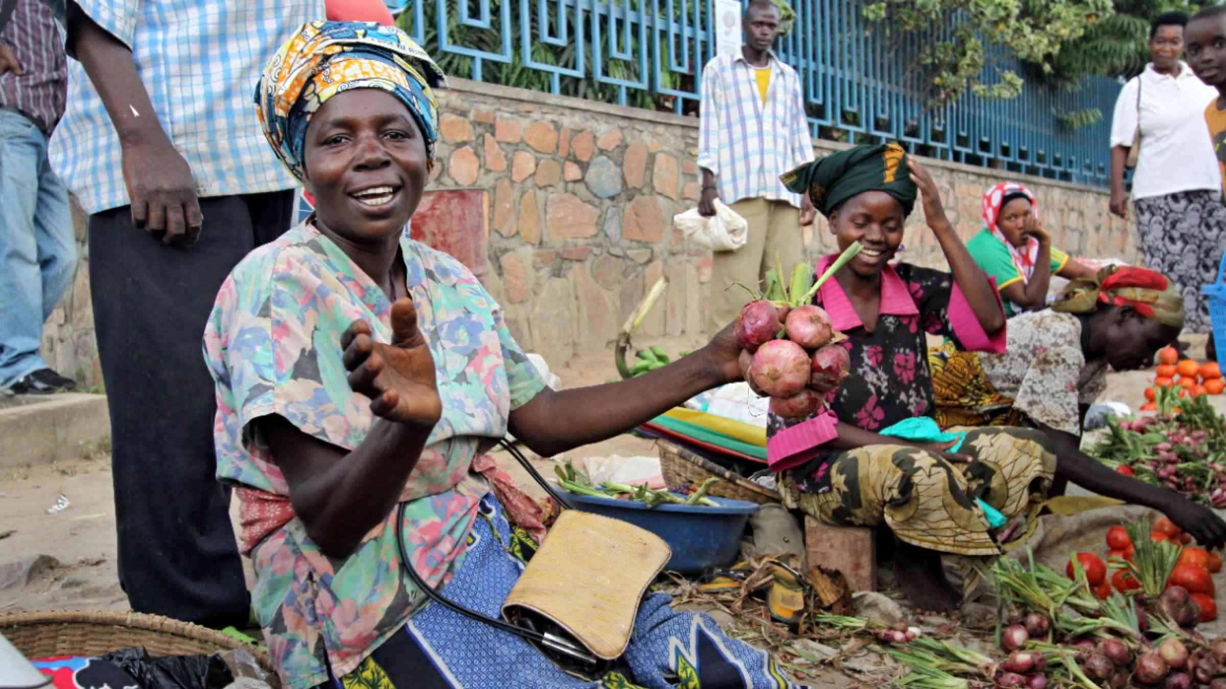 Women and men selling goods in a market in Burundi