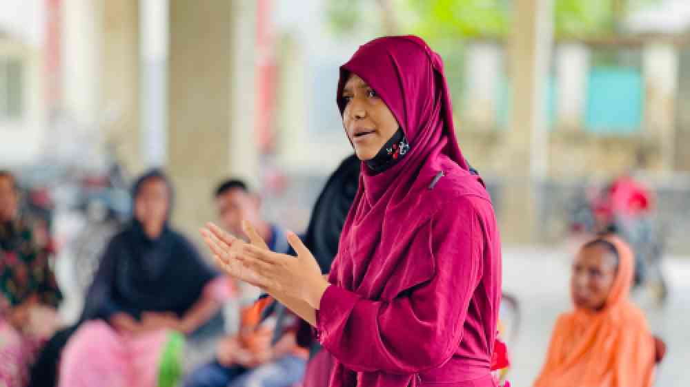 An SHG leader during a community discussion