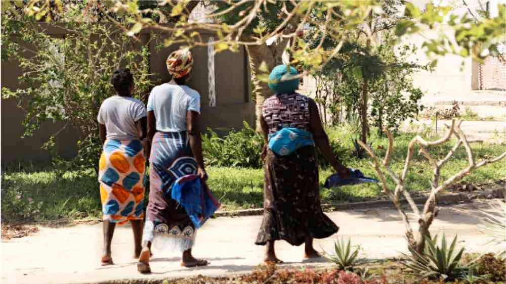 Three women walking in Beira, Mozambique