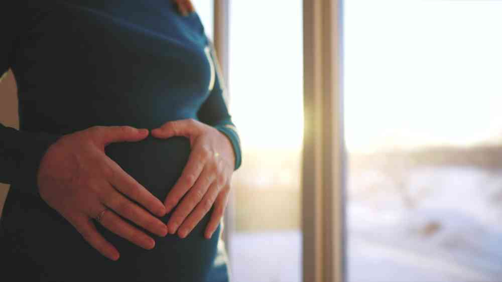 Close-up of a pregnant woman's belly.