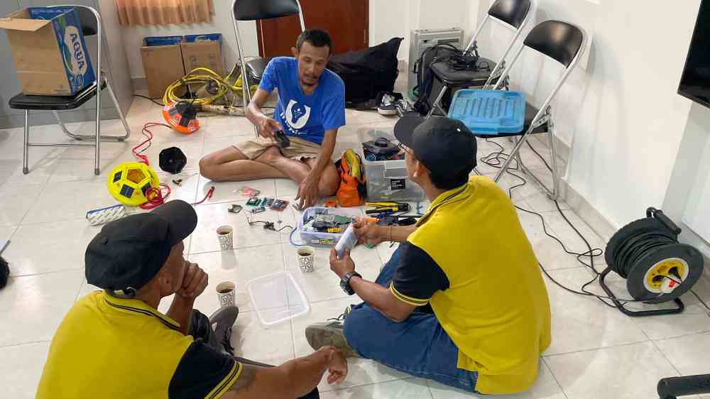 Team of technicians making the buoy which is part of the CoastalSense network