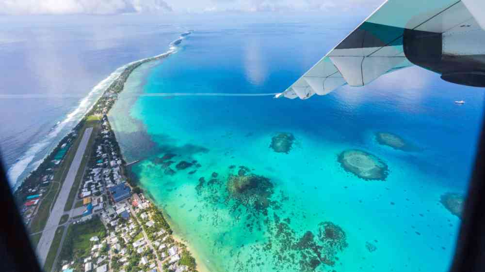 Aerial view of Funafuti atoll and airstrip of international airport in Vaiaku from air.