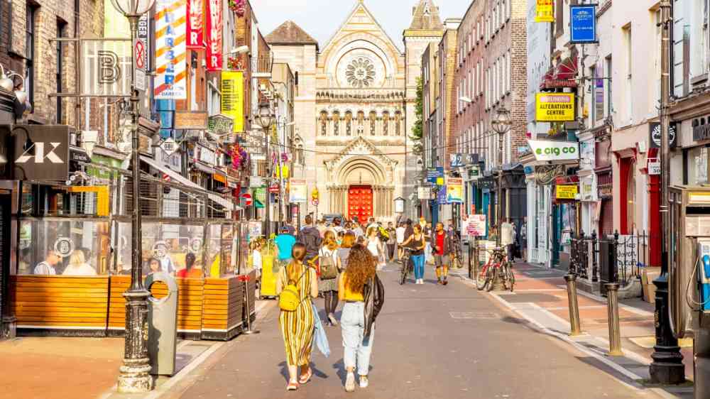 Panorama of sunny busy street in Dublin old town, Ireland.