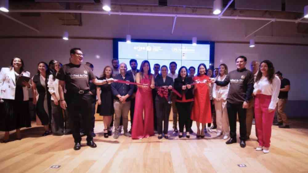 ARISE MX participants cutting a ribbon at an event