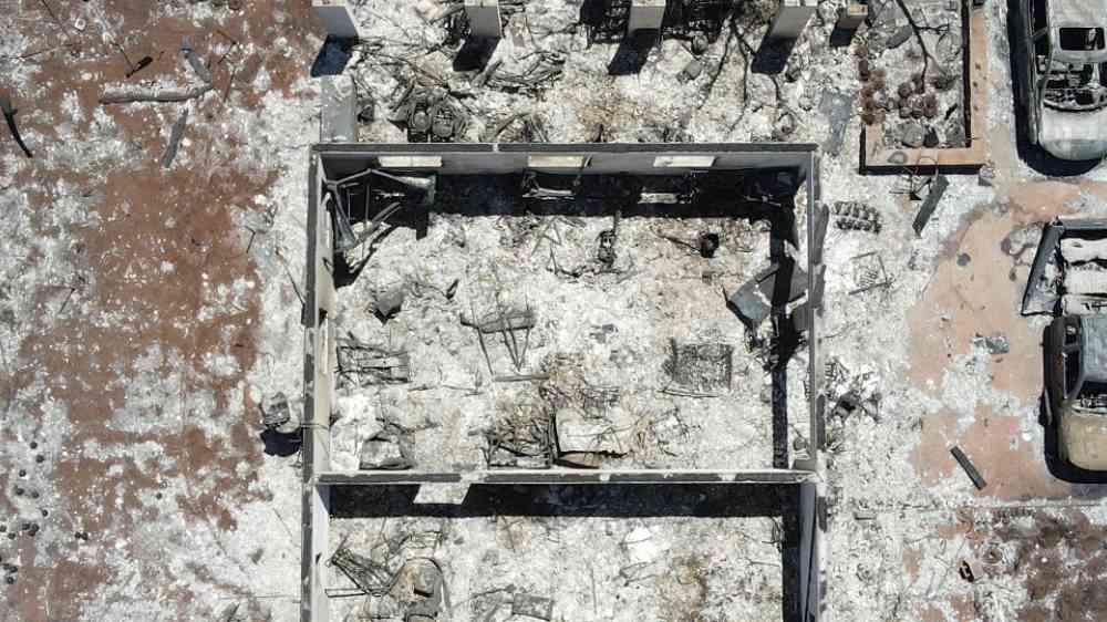 Burnt house and cars in Lahaina, Maui, Hawaii, 2023