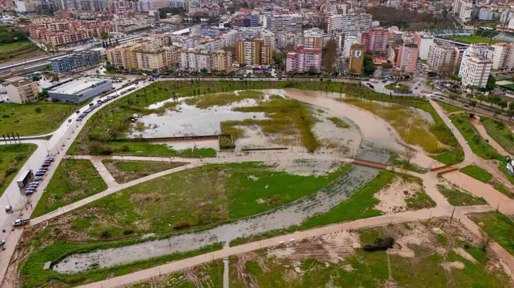 A flooded urban park that functions as a retention basin