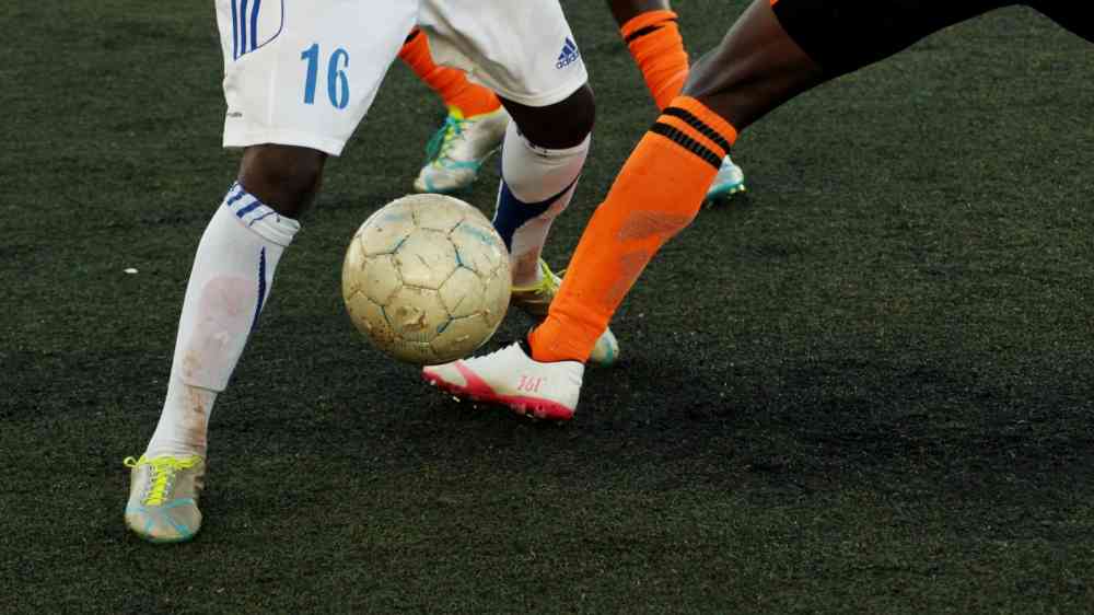 Two men playing football