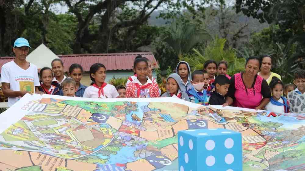 Dice on a map with kids in the background
