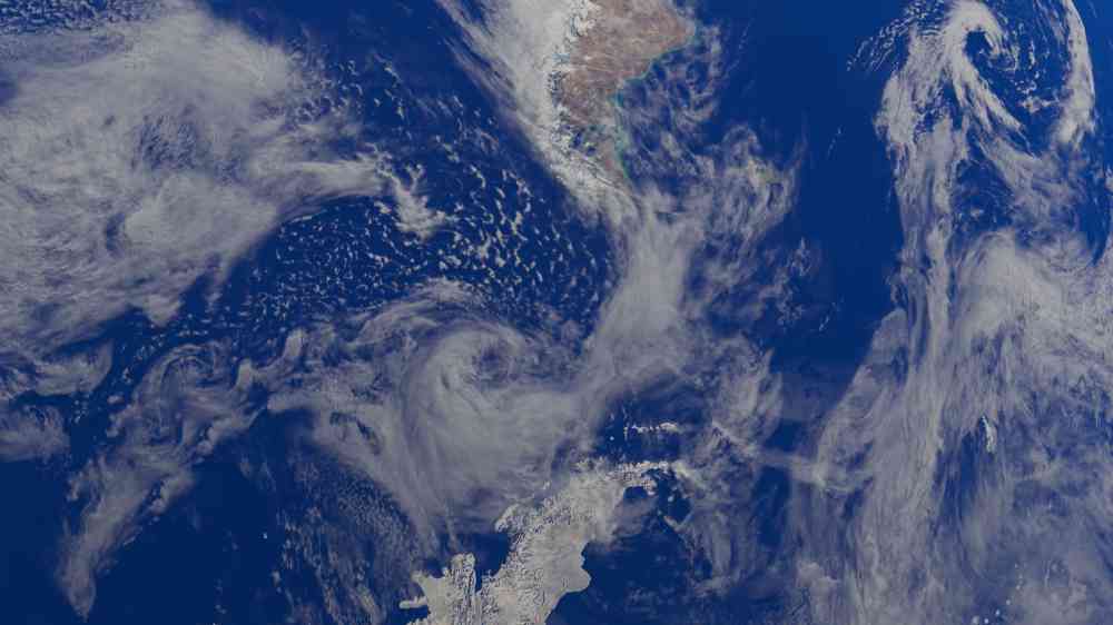 A mesmerizing satellite view showcasing Earth's clouds and ocean from space.