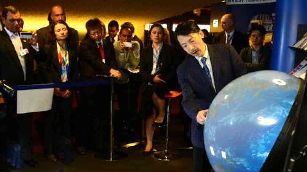 Professor Shinichi Takemura demonstrating the Tangible Earth