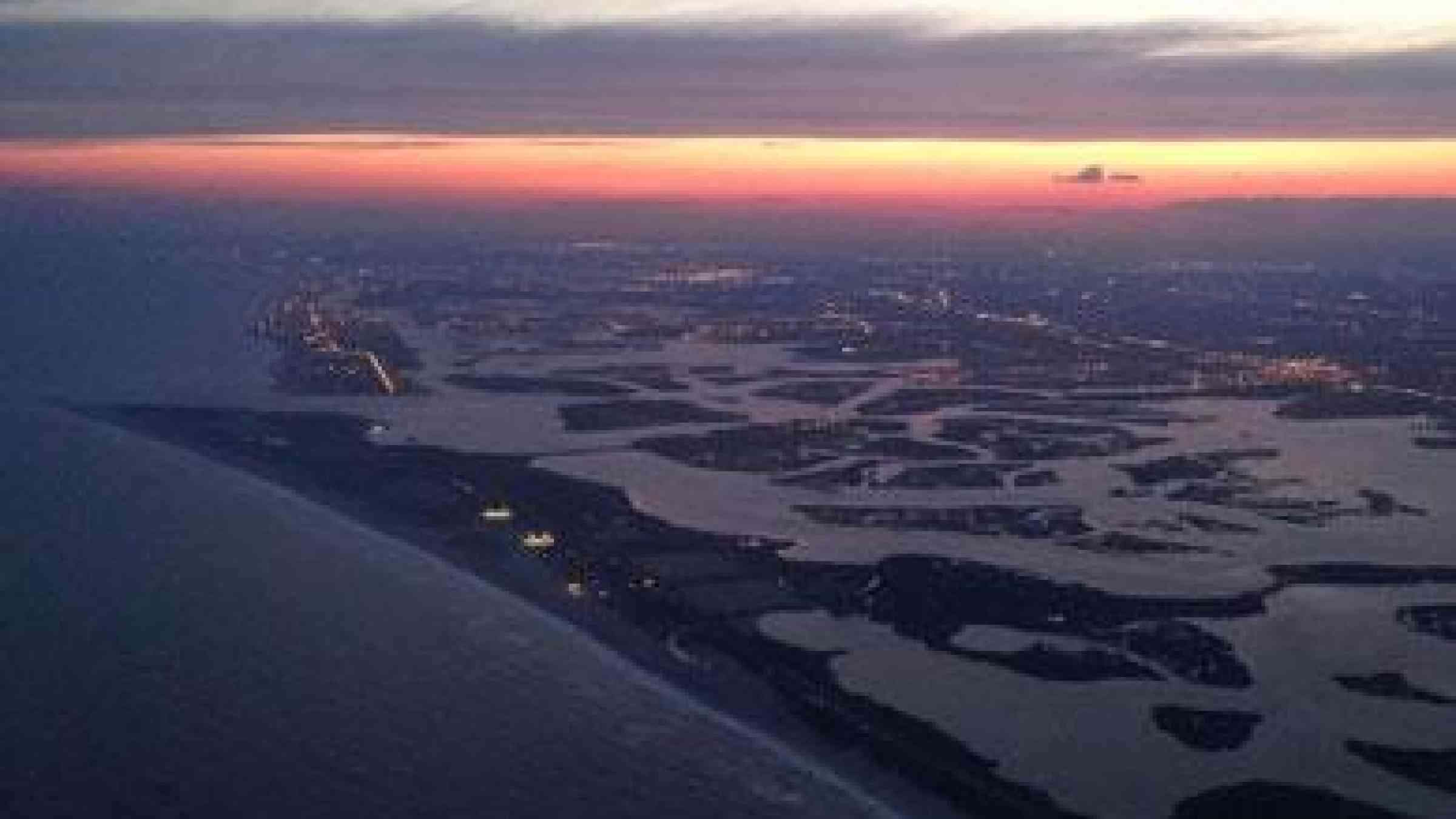 Jones Beach and the Rockaways at Magic Hour Viewd from a Plane landing at JFK - New York City, by Flickr user Chris Goldberg, CC BY-NC 2.0, https://www.flickr.com/photos/chrisgold/14368400539