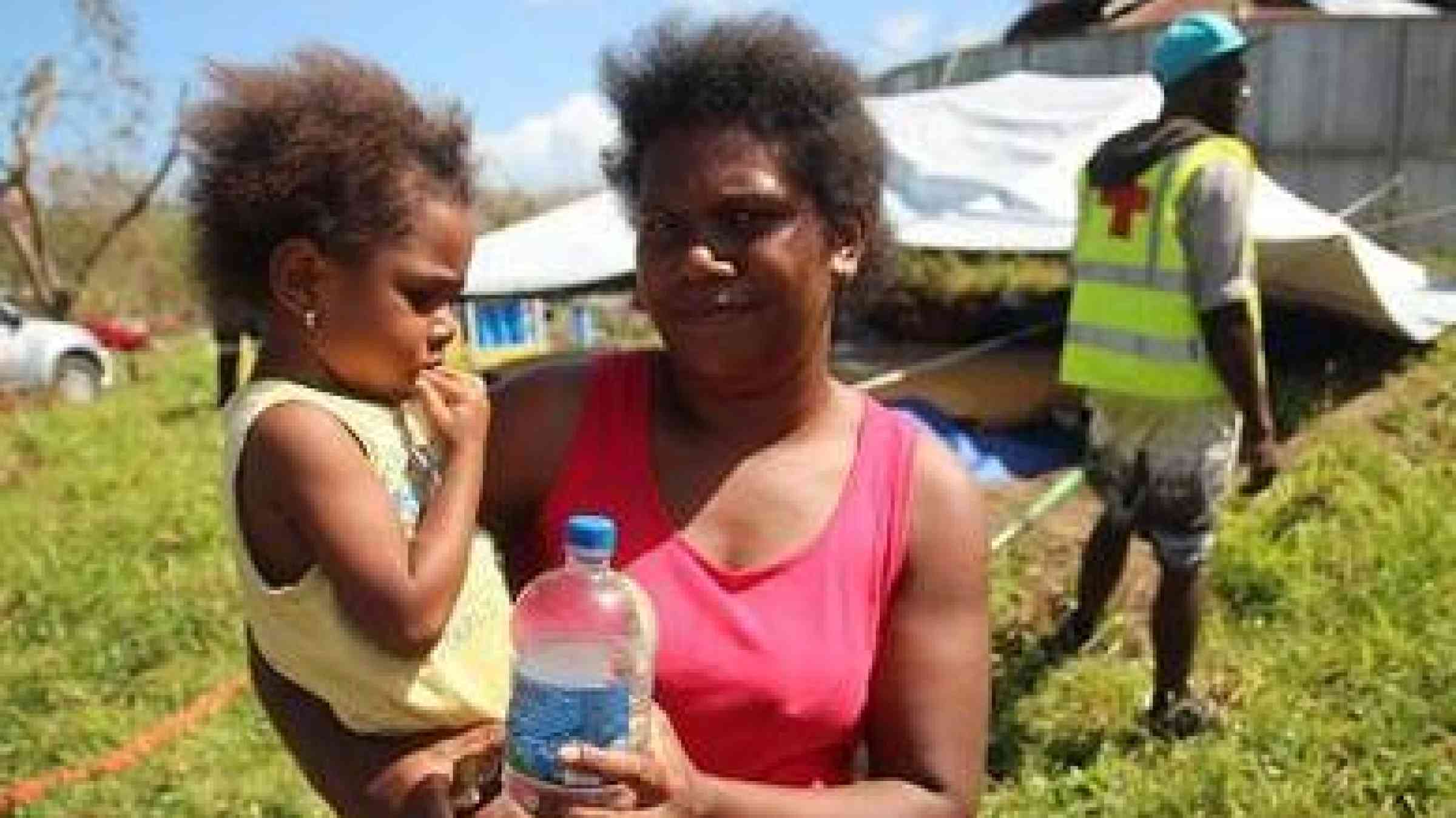 Photo by Madeline Wlison/IFRC Fabrina from Mele Village, Efate, Vanuatu is grateful to the Red Cross for warning her community over radio about the onset of severe Tropical Cyclone Pam.