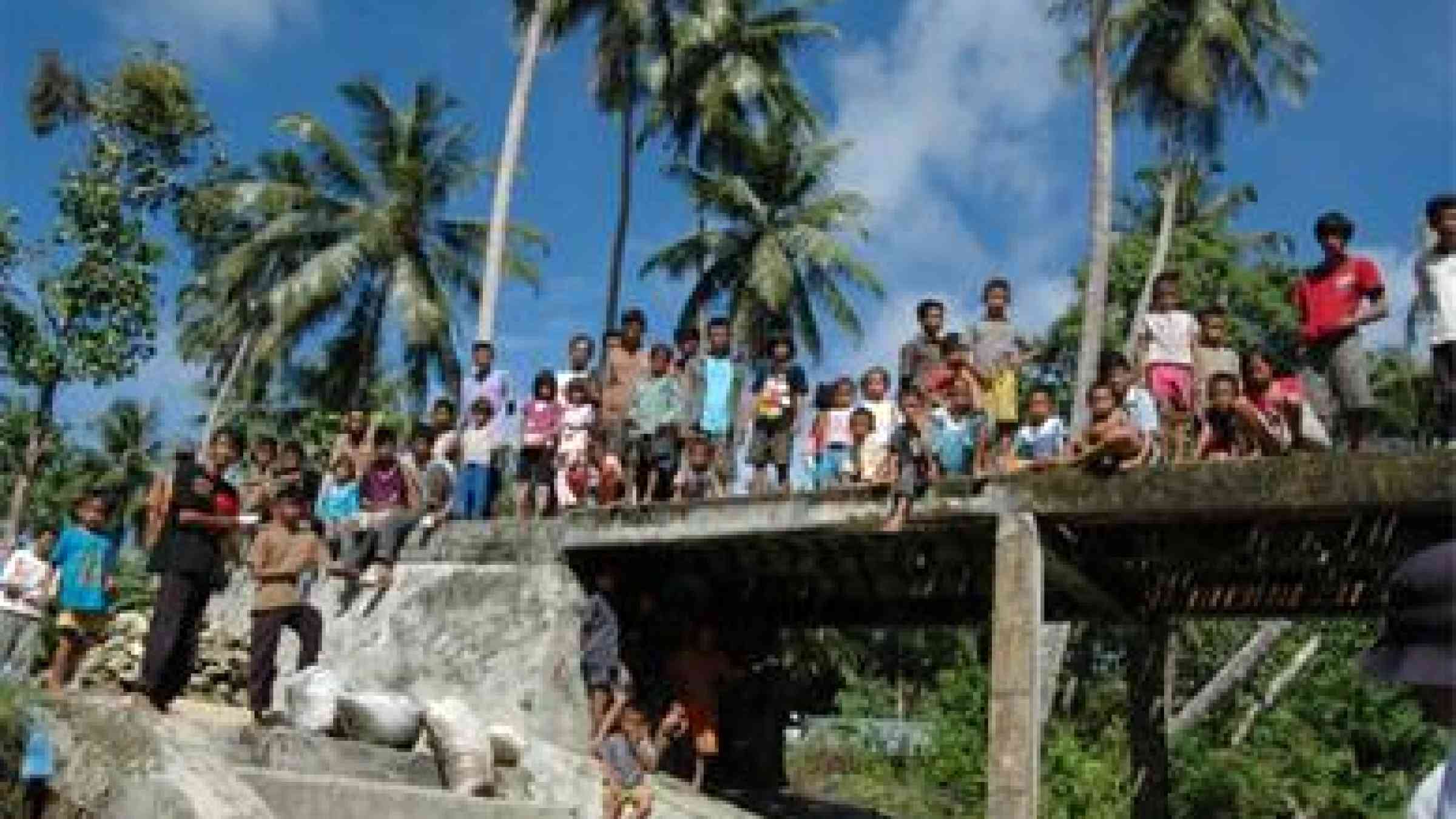 Photo by IDEP Tsunami thanks: Betumonga villagers of North Pagi, thank IDEP Foundation on a monitoring visit to the remote island, for disaster preparedness training that saved their lives in a 2010 Mentawai tsunami earthquake.