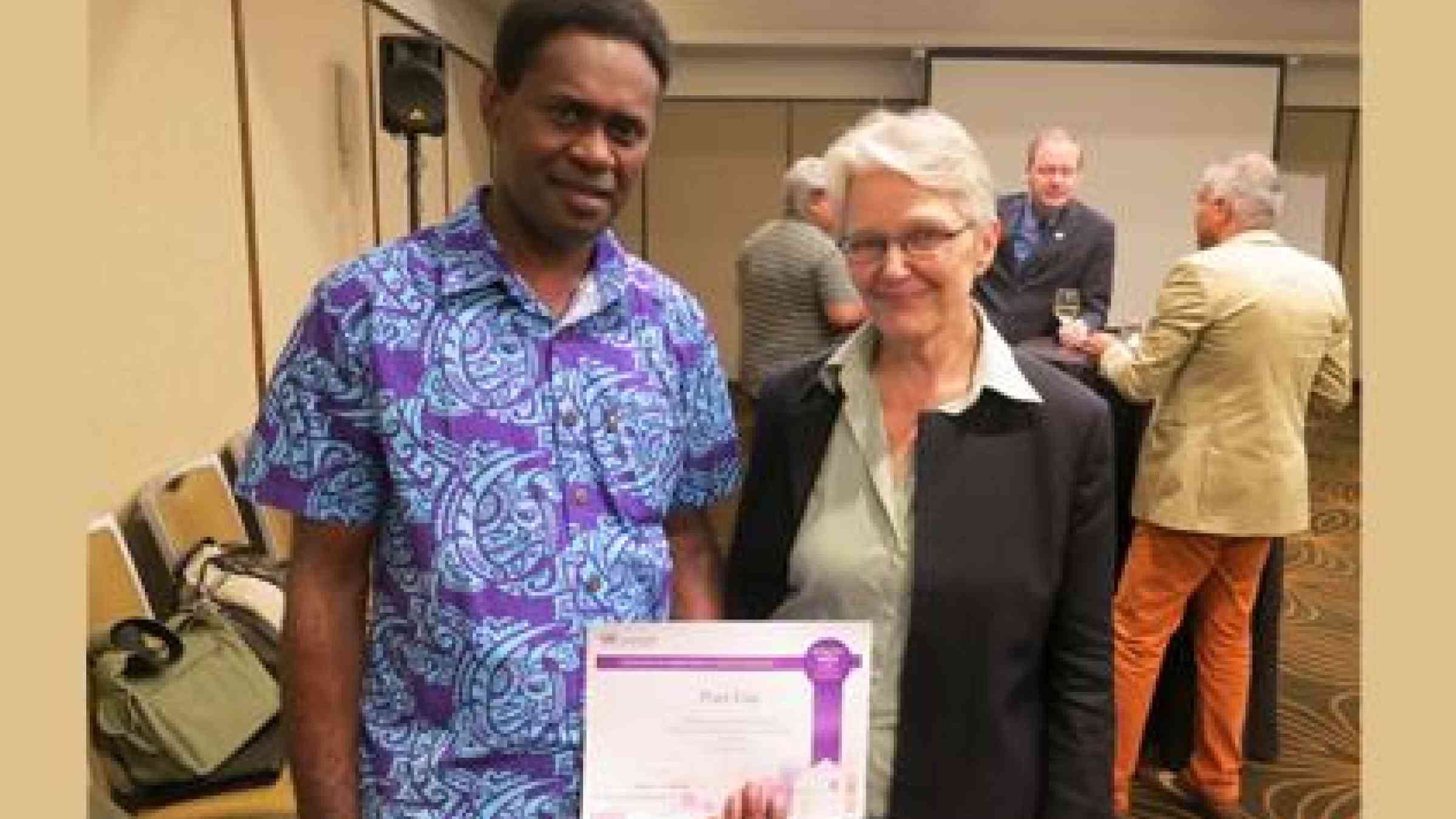 The Lord Mayor of Port Vila Mr Ulrich Sumptoh receives a Certificate of Commitment from the UNISDR's Making Cities Resilient campaign presented by  SRSG Ms Margareta Wahlström. (Photo: UNISDR)