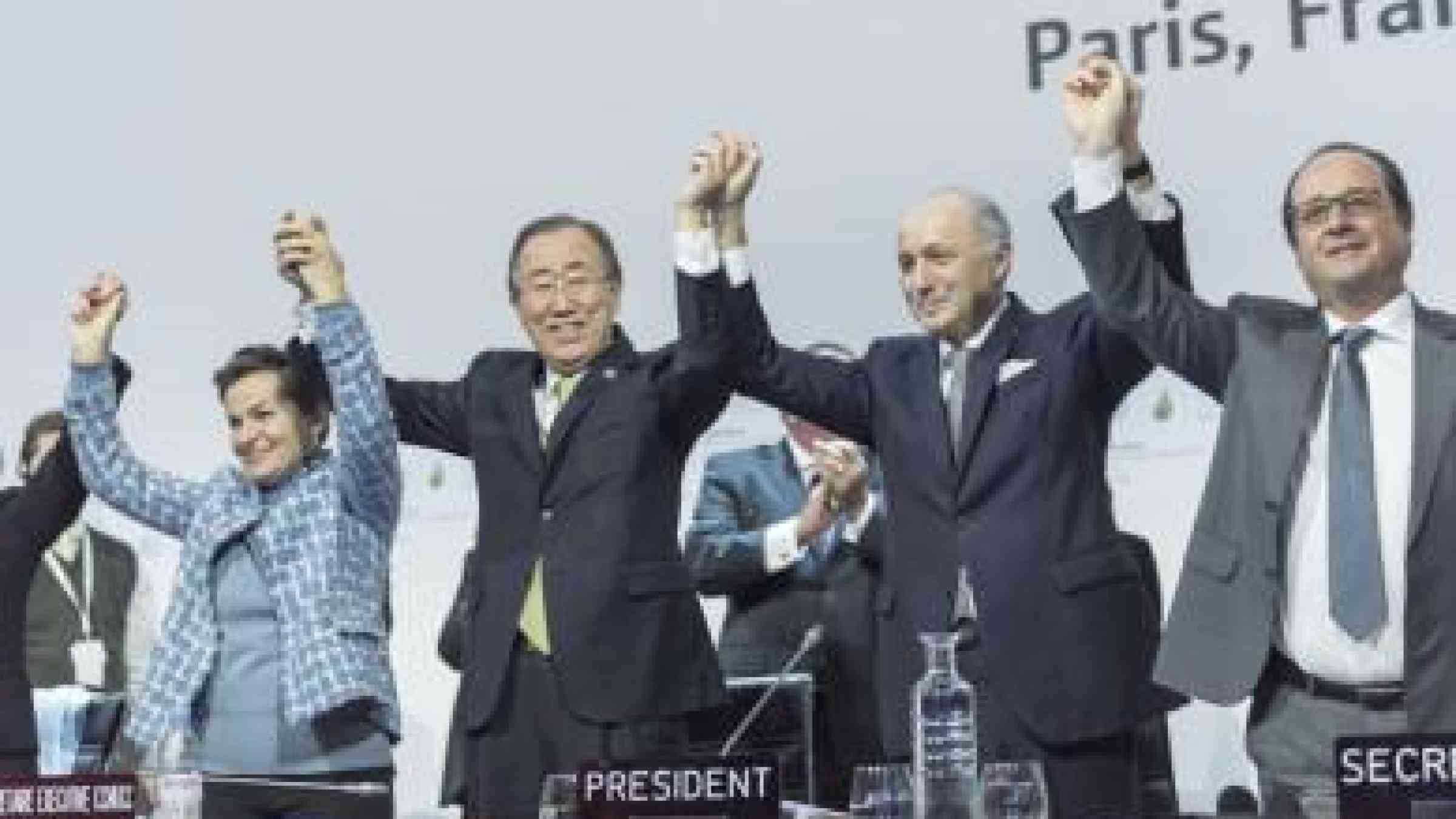 Photo by UN Photo/Mark Garten Secretary-General Ban Ki-moon (second left), UNFCCC's Christiana Figueres (left), French Foreign Minister Laurent Fabius and President of the UN Climate Change Conference in Paris (COP21), and President François Hollande of France (right), celebrate historic adoption of Paris Agreement