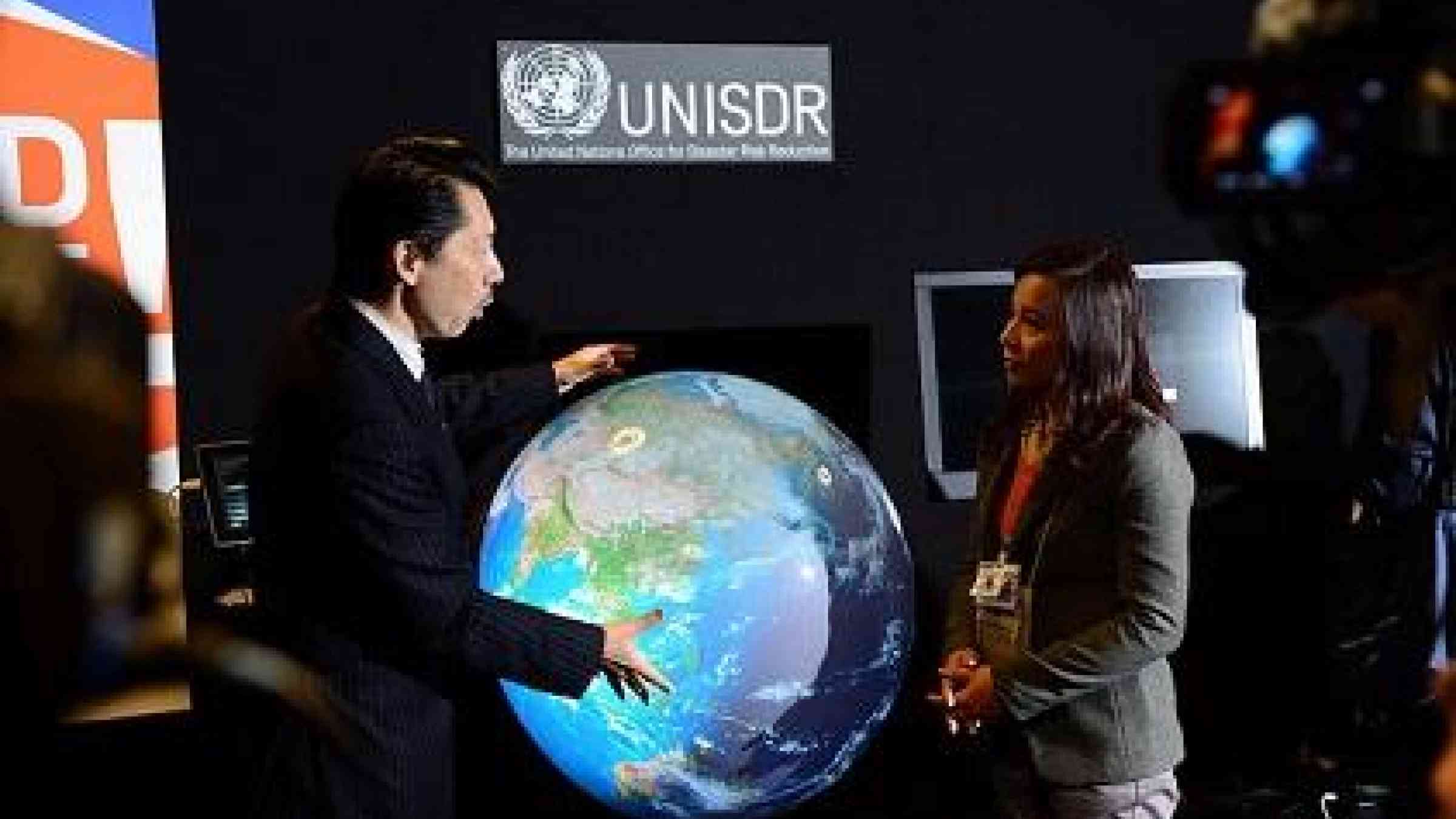 The science of disaster risk reduction in action: the interactive Tangible Earth dynamically maps risk-relevant aspects of the planet, such as real-time weather, earthquakes and tsunami, climate variations and global warming progression (Photo: UNISDR)