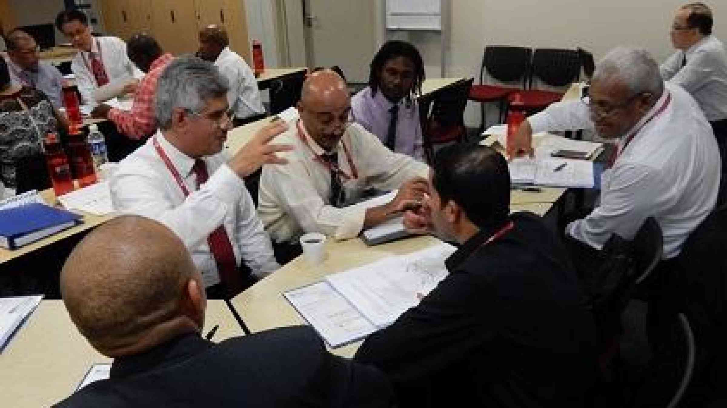 Deep in discussion: participants at the Singapore workshop debate ways to boost their countries' disaster risk management capacity (Photo: Nanyang Technological University – Centre for Continuing Education)