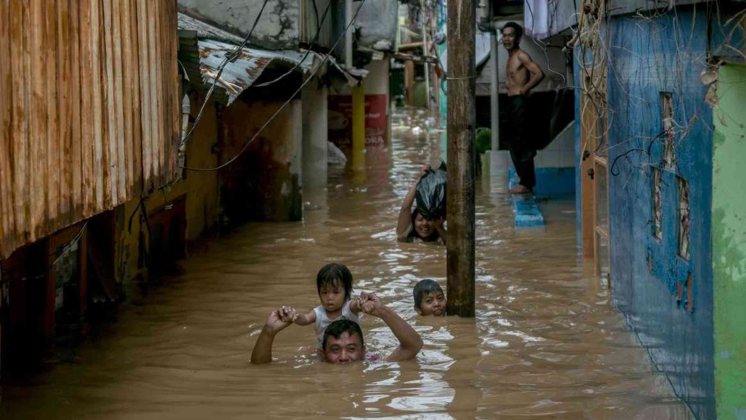 Flood in Jakarta, Indonesia. Ares Jonekson / Shutterstock.com