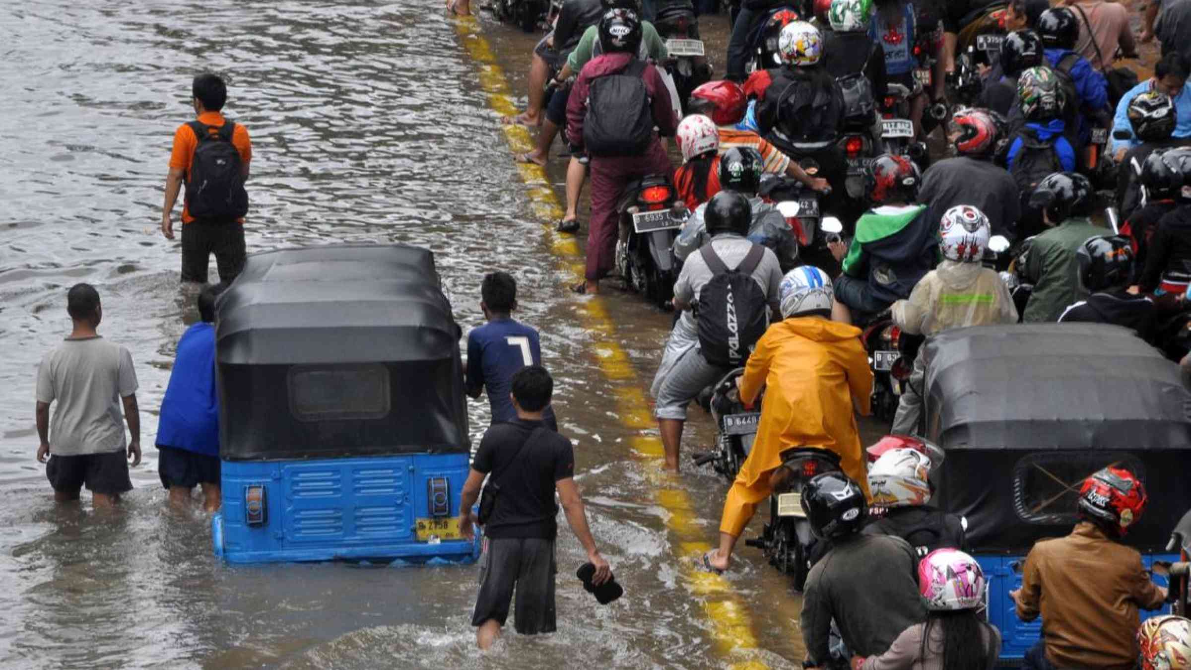Floods in Jakarta, Indonesia (2015). dani daniar/Shutterstock