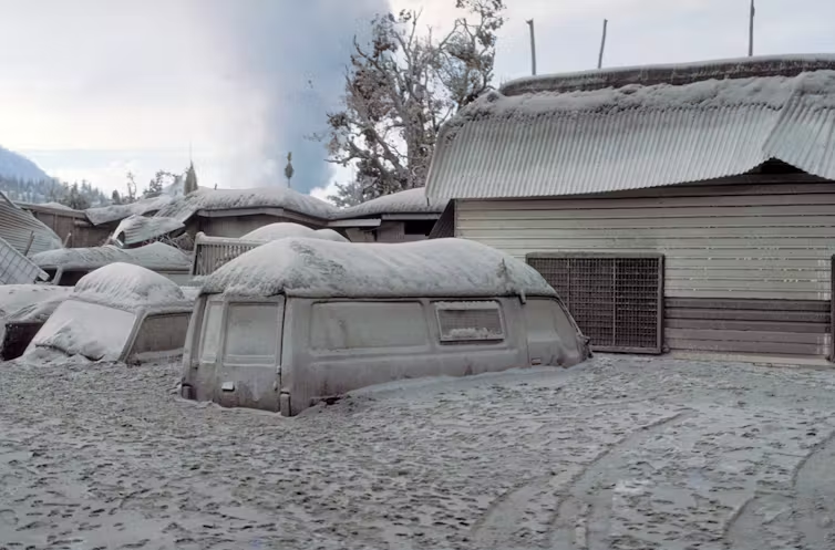 Cars buried in ash in the aftermath of Mt. Rabaul's eruption, Papua New Guinea