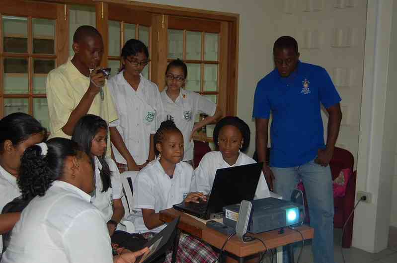 Students playing online tsunami game Stop Disasters at a tsunami workshop organized by the University of the West Indies Seismic Research Centre in Trinidad and Tobago.