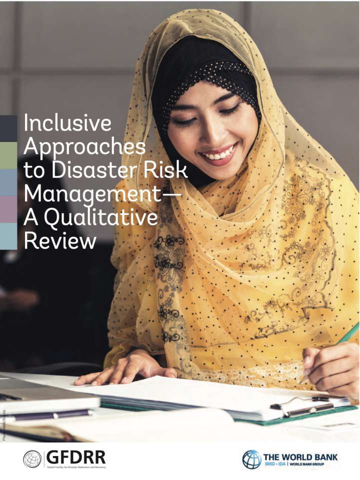 This image shows the first page of the publication which portrays woman sitting at a desk. She is wearing a yellow headscarf.