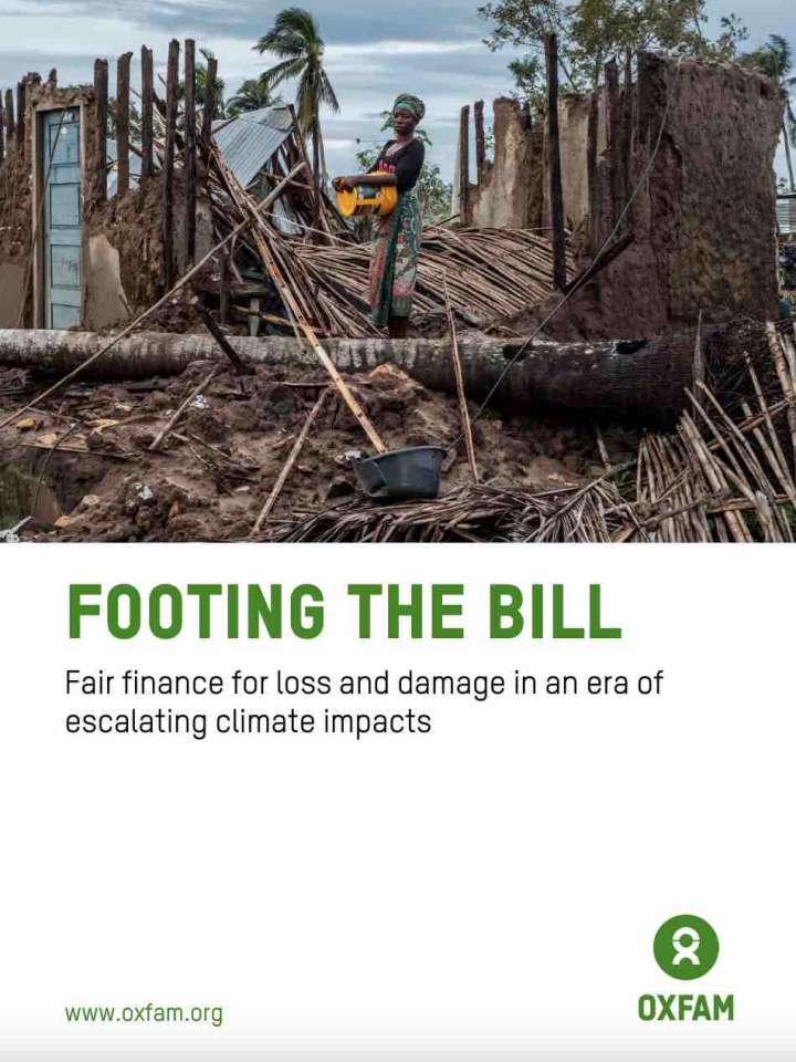 Cover of the Oxfam report: woman standing in the middle of a destroyed house