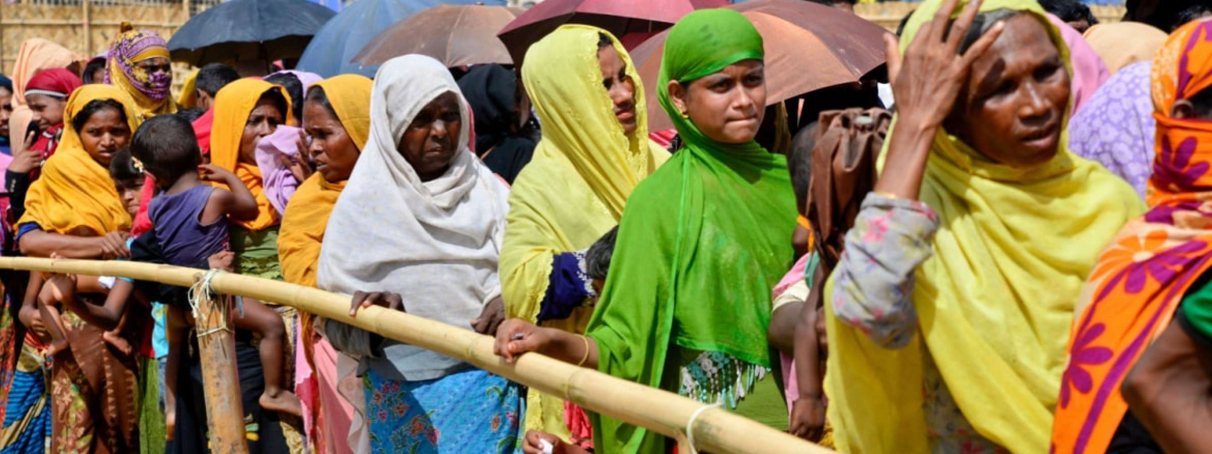 Rohingya refugee women wait to collect relief aid at the palongkhali makeshift Camp in Cox's Bazar, Bangladesh, on October 06, 2017