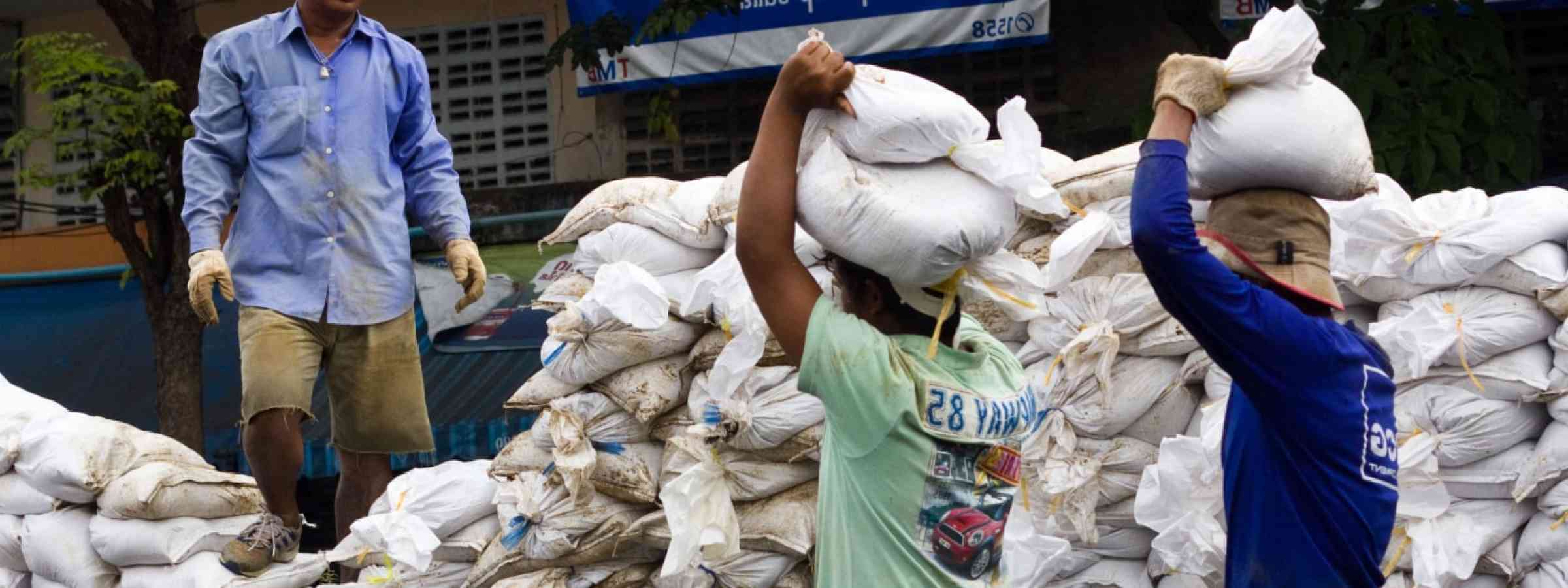  People bringing sandbags to prevent flooding in Bangkok, Thailand